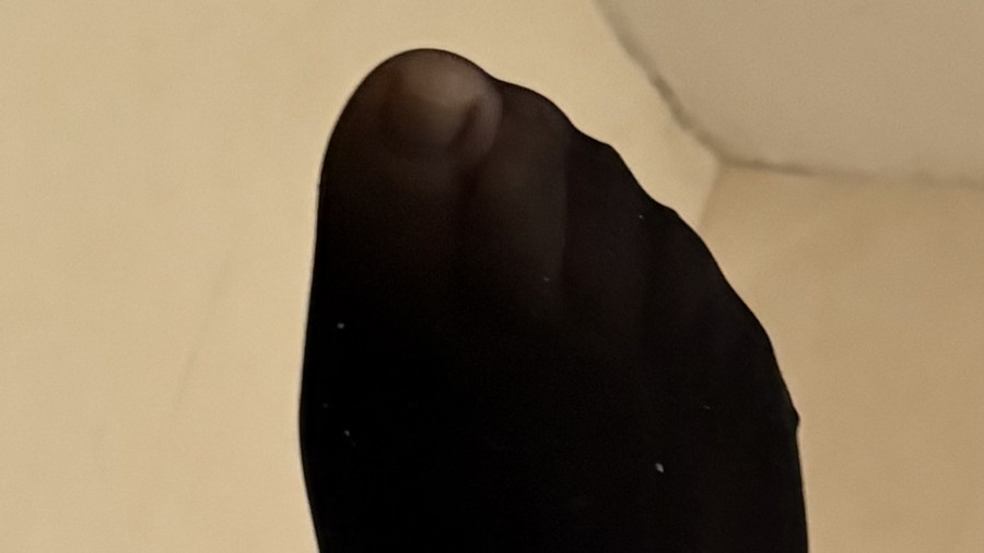 Füße in Nylonstrümpfen